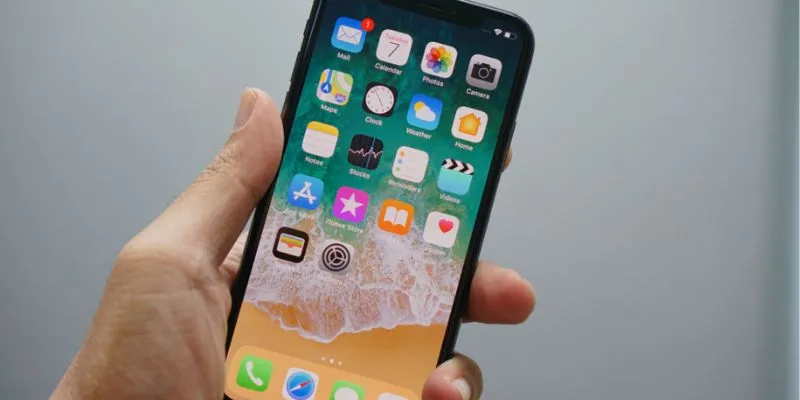 A minimalist iPhone home screen after app removal.