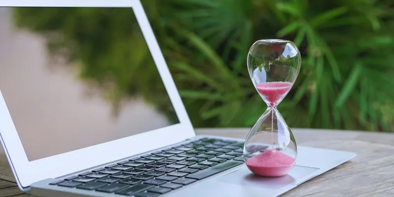 Person using a Pomodoro timer on a laptop